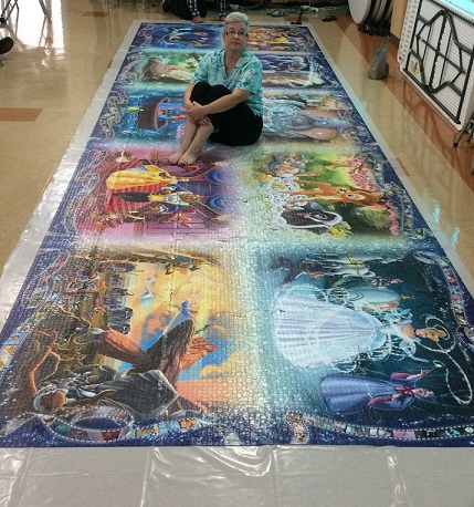 Girl completes a 40,320 piece jigsaw puzzle. - Awesome